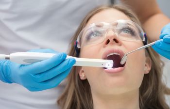 woman undergoing laser cavity detection at Family Dentist near Milton GA